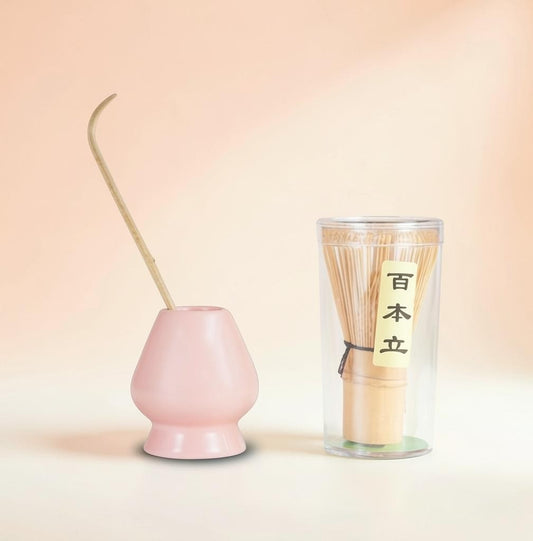 LISATA MATCHA bamboo whisk and scoop set with a pink porcelain stand for drying on a soft peach background