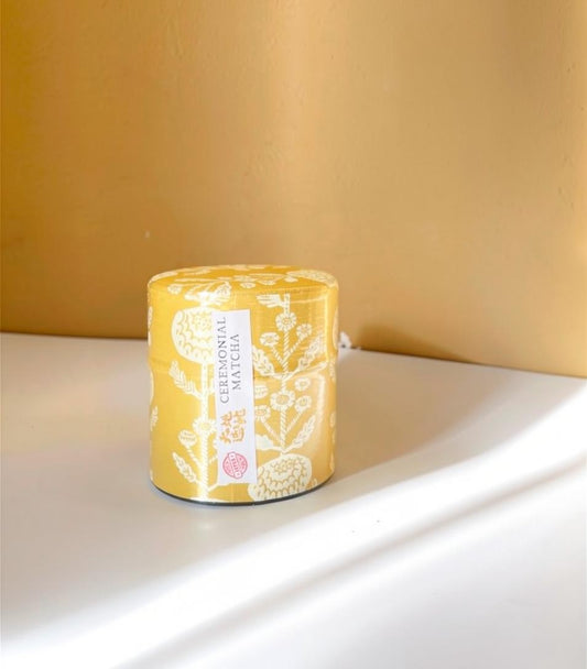 LISATA MATCHA ceremonial grade matcha in a reusable yellow floral patterned tin canister