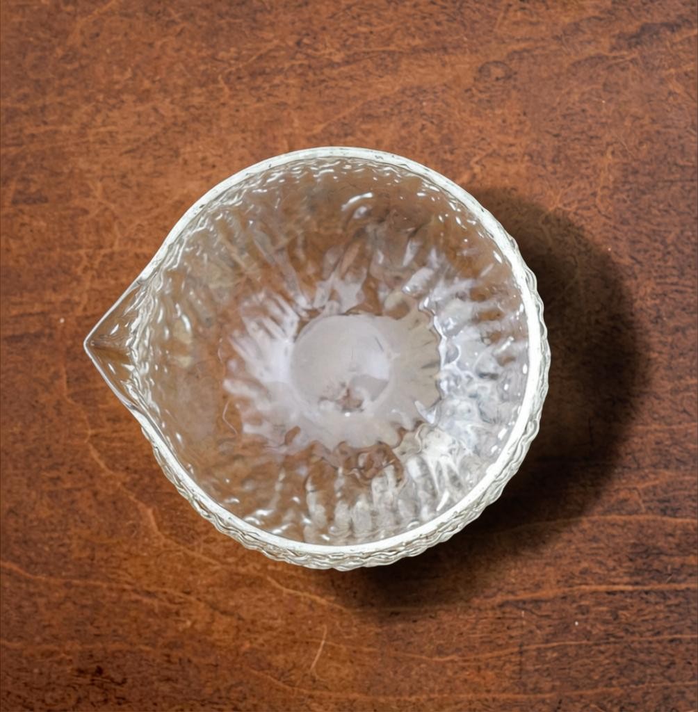 LISATA MATCHA 16oz glass matcha latte bowl with a textured surface and pouring spout, viewed from above.