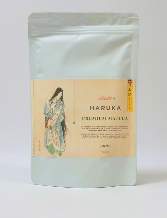 LISATA MATCHA Hakura premium green tea powder in a sealed 100g bag with traditional Japanese artwork on the label.