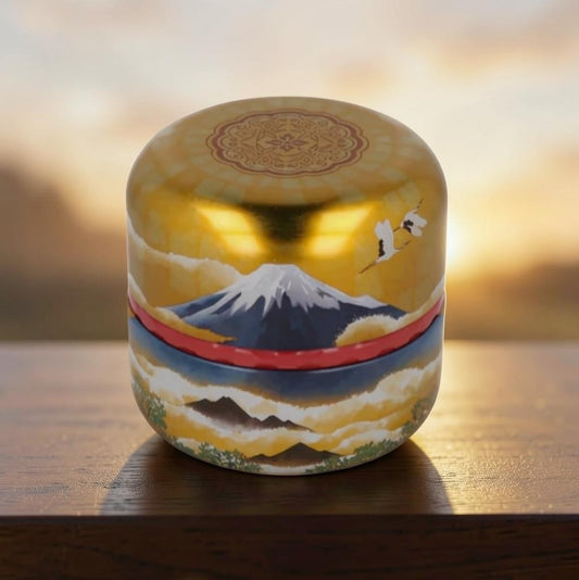 LISATA MATCHA Japanese aluminum tea canister featuring a gold Mount Fuji landscape design on a wooden surface.