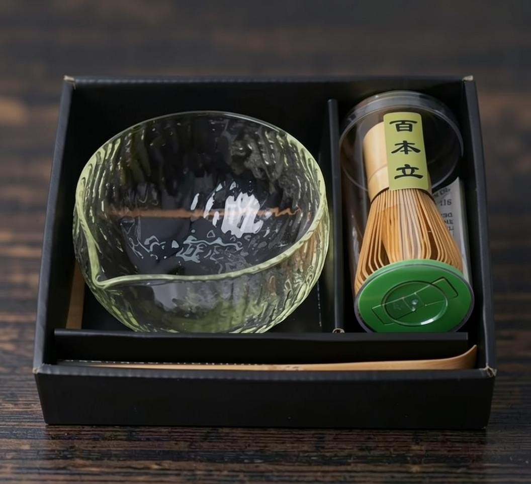 LISATA MATCHA starter bundle featuring a textured glass matcha bowl, bamboo whisk in a case, and bamboo scoop in a box.